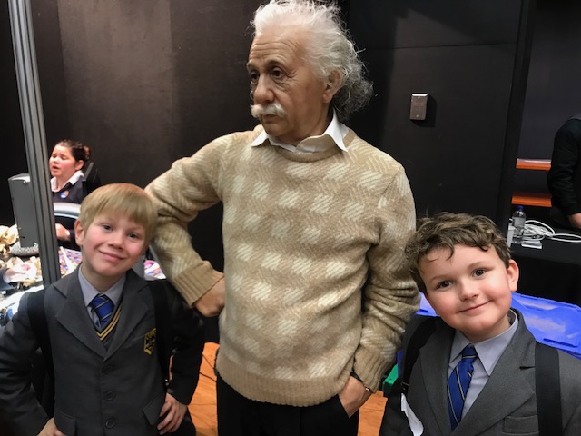 Two Coogee Prep boys with a visiting presenter at a science event