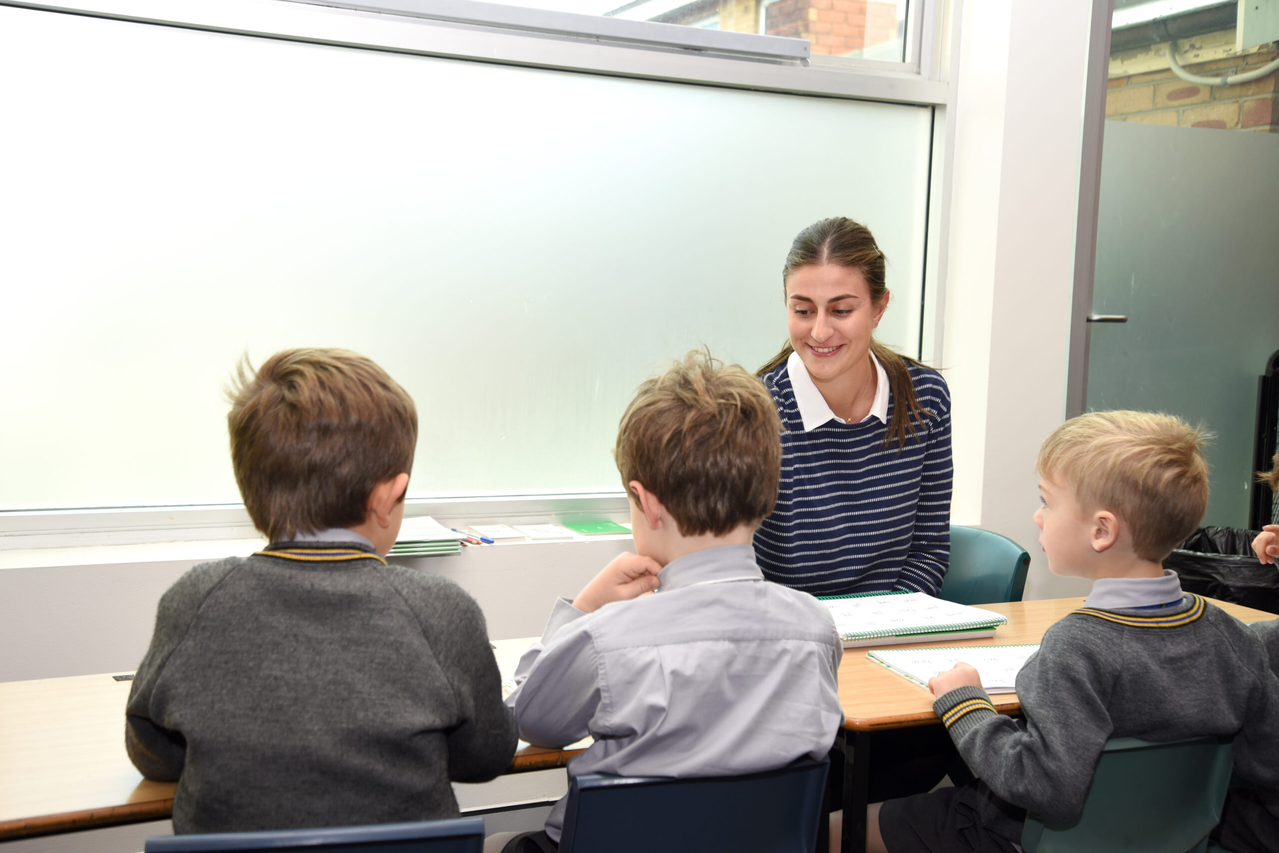 A small group of Coogee Prep boys working with their teacher