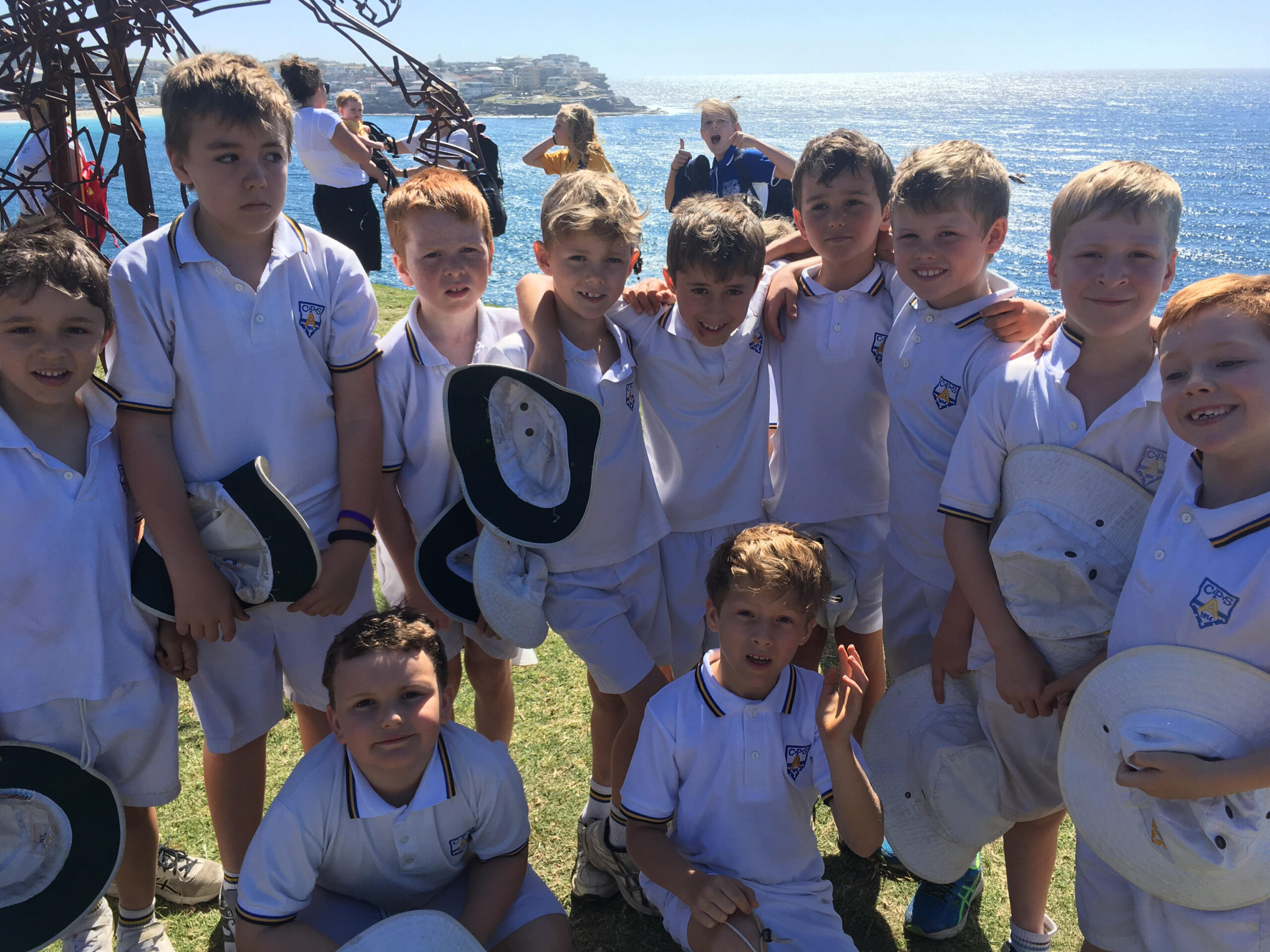 A Coogee Prep cricket team photographed by the coast