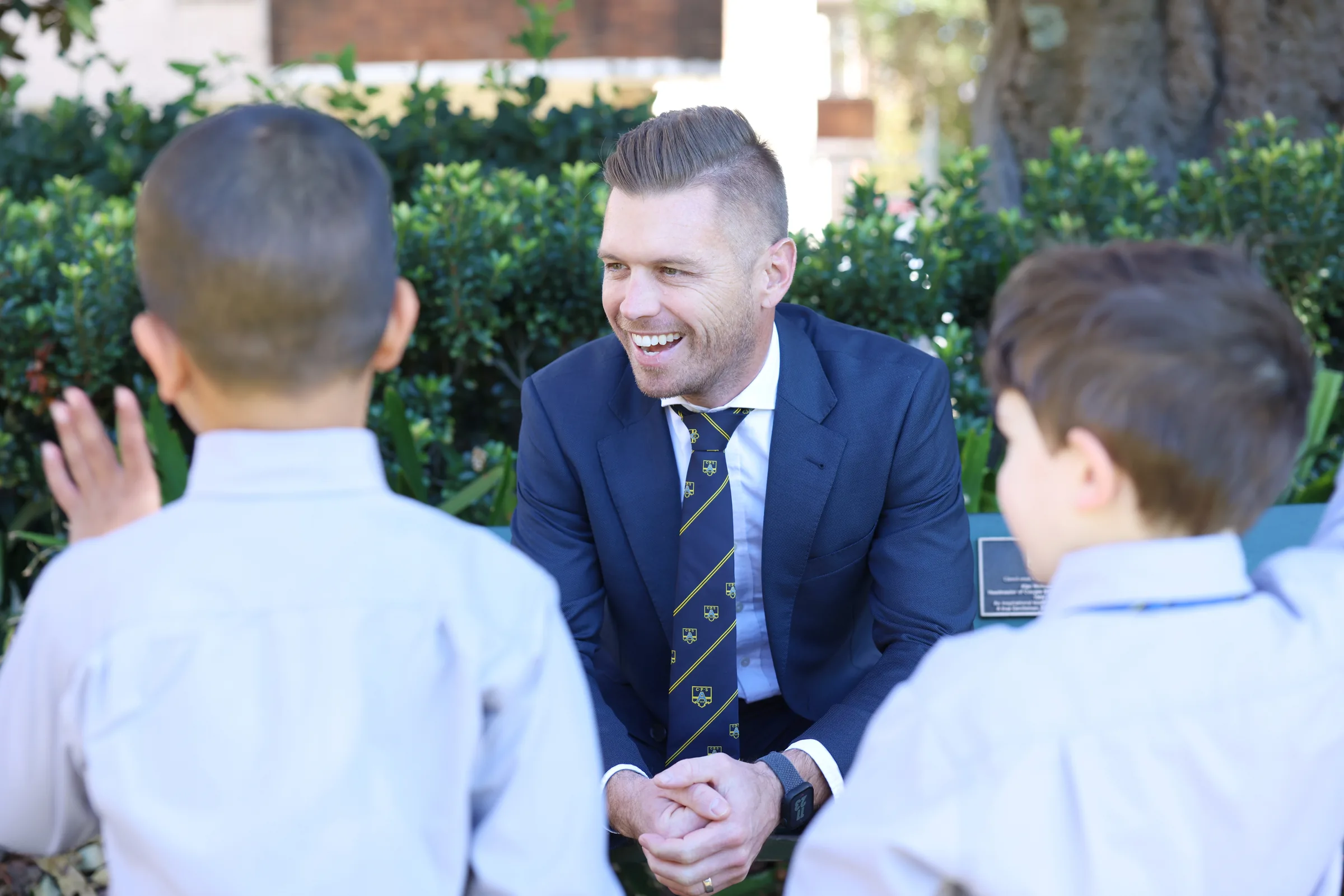 Jason Wren-Pattison greeting Coogee Prep boys in the playground